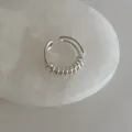 Detail of silver multi-layer coiled open ring on white marble stone background - Double-layer Winding Ring
