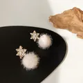 Detailed view of elegant snowflake earrings featuring white fur pom poms and crystals - Snowflake Pom Pom Style (925 Sterling Silver Earring Post)