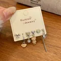 Asymmetrisches Silberohrring-Set mit Katzenpfote, Teddybär und Perlenanhängern - Brauner Bär Ohrhaken (MMT12)