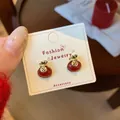 Festive red lucky bag stud earrings with golden coin symbols for New Year outfit - Red Fortune Bag Style (ZCM3)