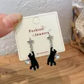 Asymmetric black flocked cat earrings with silver stars and sparkling crystal accents - Flocking Star Reaching Black Cat Earrings (MMW51)