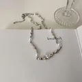 Irregular silver textured necklace with white pearls and oval zircon in a minimalist style - Irregular Metal Necklace Gold Plated