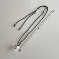 Long braided cord necklace with silver heart pendant and measuring ruler for size scale - Large Silver Heart Pendant Black Rope Style (B-293)