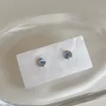 Detail of star and moon stud earrings featuring a blue opal stone and micro-set crystals - Planet Stud Earrings 925 Sterling Silver Earring Post Gold Plated