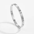 Detail of silver clover engraved bangle with embedded round rhinestones and side hinge - Silver Rhinestone Four-leaf Clover Style (4153)
