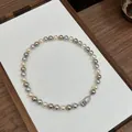 Elegant multi-colored pearl necklace featuring cream, grey and coffee pearls with silver clasp - Mixed Multi-color (Gold Plated)