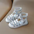 Silver gladiator-style sandals for girls featuring metallic T-straps and velcro closures - EU 23 / Silver