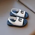Kids black and white leather sandals with elastic heel strap and bold letter pattern - EU 24 / White