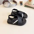 Kids' black and white contrast beach sandals with adjustable velcro straps and rubber soles - EU 26 / Black and White Patchwork