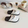 Girls' black and white flat sandals with golden letter hardware for casual wear - EU 26 / White
