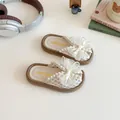 Sandali marroni per bambine con grande fiocco in rete ed eleganti decorazioni di perle - EU 21 / Beige