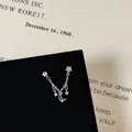 Macro shot of silver-tone moon and star chain earring with pink and white cubic zirconia - Star Moon Connect Chain Style (5506020064629)