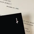 Macro detail of planet-shaped silver stud earring with pink zircon and micro-diamonds - Niche Design Planet Meteor Style (5506020064634)