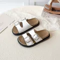 Girl's white dual-strap slide sandals with silver buckles and ergonomic brown footbeds - 31-35 / White