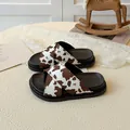 Kids platform slide sandals with brown cow print pattern and thick non-slip soles - EU 26 / Brown
