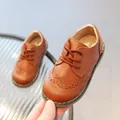 Classic brown leather brogue shoes for kids with lace-up style and durable rubber soles - EU 21 / Brown