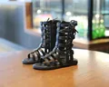 Detail view of girls' black gladiator sandals with high-top hollow cutouts and back zipper - 21 / Black