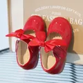 Red patent leather Mary Jane shoes for girls featuring a large velvet bow detail - 19 / Red