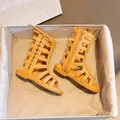 Fashionable girls bright orange-yellow gladiator sandals with cross laces and inner zipper - EU 21 / Brown