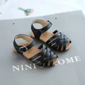 Girls' black woven leather sandals with buckle strap and soft sole beach princess shoes - EU 21 / Black