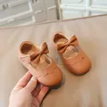 Brown Mary Jane baby walking shoes with textured leather and a large decorative bow - 19 / Brown