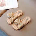 Beige girls' open-toe slippers featuring a soft sole and a large decorative bow detail - EU 26 / Brown