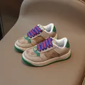 Kids casual sneakers featuring vintage brown monogram pattern and green accents - EU 22 / Brown