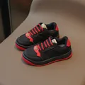 Kids sports sneakers in classic black and red colorway with stylish gold accents - EU 22 / Black