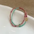 Close-up of double-layer beaded bracelet with pink and green natural stones and gold spacers - Red Wood Grain & Green Aventurine Patchwork Bracelet