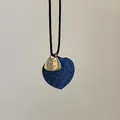 Detail of blue denim heart pendant with Take It Easy engraving on black woven rope - Denim Blue Heart Necklace