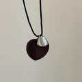 Detail of heart necklace with silver plate engraving TAKE IT EASY and brown suede base - Brown Velvet Heart Necklace