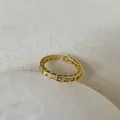 Macro detail of gold adjustable ring featuring colorful square-cut inlaid gemstones - Multi-Color Gemstone Style (Style 1 Ring)