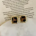 Close-up of leopard print resin earrings with elegant gold alloy square borders - 925 Silver Earring Post / Style 10 Gold Square Frame Leopard