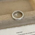 Close-up of a silver resin ring featuring multiple round zircons in a bezel setting - Zircon / Silver Micro-inlaid Zirconia Ring