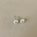 Close-up of French vintage irregular pearl earrings with hammered metal texture - Hemispherical Pearl / Small (10mm)