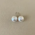 Detailed view of French vintage irregular pearl stud earrings with silver needles - Round Pearl / Medium (12mm)