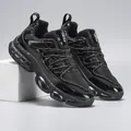 Macro side view of black breathable mesh and shiny patent leather panels on chunky sneaker - EU 40 / All Black