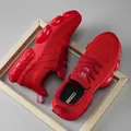 Red knit running shoes with lightweight cushioned bubble sole and stylish chunky design - EU 40 / Red
