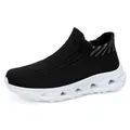 Men's black knit running shoes with white hollowed cushioning sole in 45-degree view - 36 / Black and White