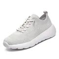 Breathable white flyknit running sneakers with lace-up closure and cushioned foam sole - 35 / Off White