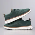 Detail of dark green breathable knit loafers for men with white soles and brown trim - 40 / Dark Green