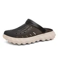 Thick platform clogs for men featuring translucent dark grey upper and wavy white sole - EU 40 / Grey Khaki