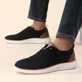 Close-up of men's breathable knit shoes with brown leather brogue details and denim pants - EU 40 / Black