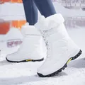 Close-up of waterproof white snow boots with quilted texture and faux fur trim - EU 38 / Lace-up Style White