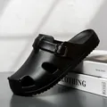 Men's black Birkenstock-style clogs with lychee leather texture and buckle strap - 36-37 / Black