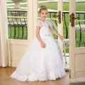 Detail of white flower girl dress with lace embroidery, rhinestone waist, and tulle skirt - 2-3Y / All White