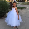 Detail of the intricate lace bodice and tiered tulle skirt on this white flower girl dress - 8-9 Years / White