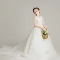 Detailed view of girls white princess gown with floral embroidery and long tulle train - White Trailing Style / 110cm