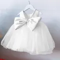 Close-up of white flower girl dress featuring pearl neckline and large satin bow detail - 80cm / White