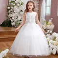 Detailed view of pearl white satin bodice with floral embroidery and layered tulle skirt - 8-9 Years / Beige